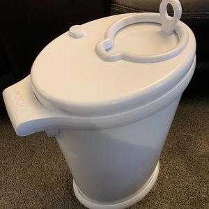 Ubbi diaper pail, odor free never used, includes pack unopened diaper bags.